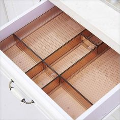 an open drawer is shown with drawers in the bottom and bottom sections on each side