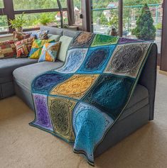 a couch with a blanket on top of it