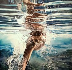 a man swimming under water in the ocean