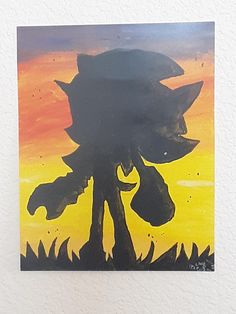 a painting of a sonic the hedgehog on a white wall with yellow and orange colors