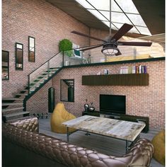 a living room filled with furniture and a flat screen tv sitting on top of a wooden table