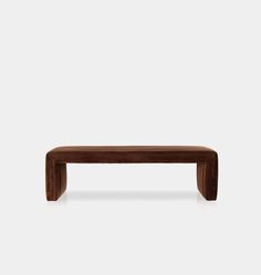 a wooden bench sitting on top of a white floor