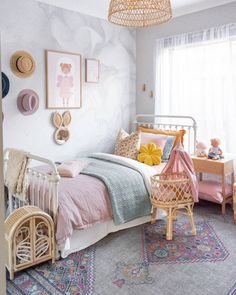 a child's bedroom decorated in pastel colors