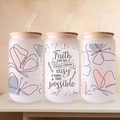 three personalized tumbles with the words faith is my happy thing, it makes me happy and possible