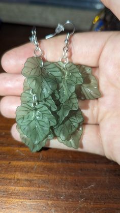 These lovely earrings would be an amazing addition to anyone's jewelry collection! Green Leaf-shaped Sterling Silver Earrings, Mythical Aesthetic, Trinkets Aesthetic, Cottage Outfits, Ivy Earrings, Plant Earrings, Wire Wrapped Jewelry Diy, Mushroom Earrings, Witch Jewelry