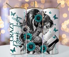 two white coffee mugs with blue flowers and butterflies on them, one has a girl reading a book