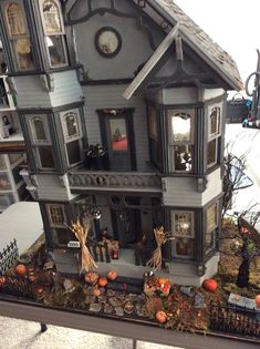 a doll house is decorated with halloween decorations