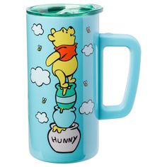 a blue mug with winnie the pooh on it