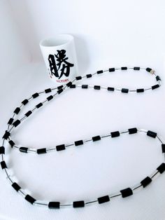 Hand strung 34' long length necklace made with pressed black glass and clear pressed glass beads. Great for any occasion, it  can be adjusted to create a choker style  look, It can be worn by male or female, and it's made on a durable stretch cord. Great gift for mom or dad, co-worker, or friend, one of a kind. Choker Style, Great Gifts For Mom, Glass Bead Necklace, Black Glass, Wedding Necklace, Chain Styles, Costume Jewelry, Necklace Lengths, Gifts For Mom