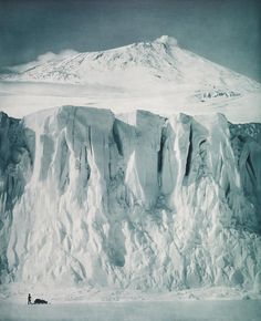 an ice covered mountain with snow on it