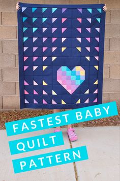 a baby quilt with the words fastest baby quilt pattern in front of it and an image of a heart