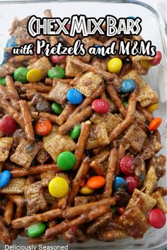 chex mix bars with pretzels and m & m's in a glass dish