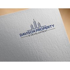 the logo for davidson property development, which is located in an area that looks like it has