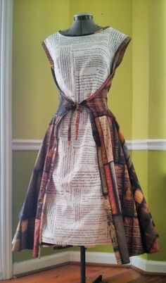 a dress made out of newspaper on a mannequin