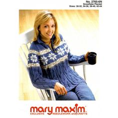 a woman sitting in a chair wearing a blue sweater and holding a cup with her right hand