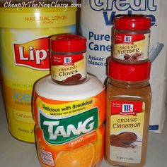 three jars of food sitting on top of a counter next to a bag of flour