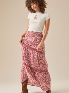 Embrace bohemian style with this flowy floral maxi skirt. The delicate floral print adds a touch of femininity and romance, while the smocked elastic waistband ensures a comfortable and flattering fit. The intricate lace details add a touch of luxury and make this skirt perfect for any occasion. Breezy Flowy Maxi Skirt With Elastic Waistband, Flowy Boho Print Tiered Maxi Skirt, Bohemian Maxi Bottoms With Floral Print, Bohemian Maxi Length Bottoms With Floral Print, Bohemian Maxi Length Floral Print Bottoms, Bohemian Flowy Maxi Skirt With Floral Print, Casual Floral Print Maxi Bottoms, Casual Maxi Length Floral Print Bottoms, Casual Maxi Length Bottoms With Floral Print