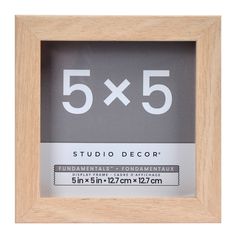 the 5x5 wooden frame is shown with white numbers