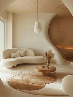 a living room filled with white furniture next to a fire place in the fireplace area