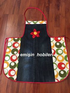 an apron with the words emiisin hollier on it sitting on a wooden floor