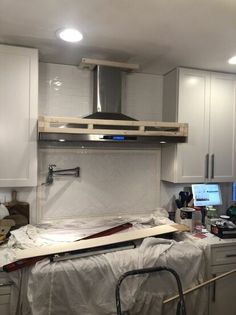 the kitchen is being remodeled and ready to be used as a work space for an office