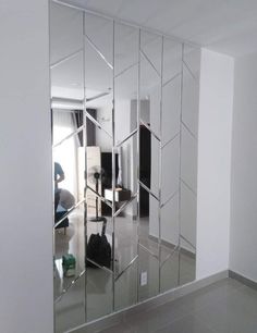 a large mirror reflecting the room in it