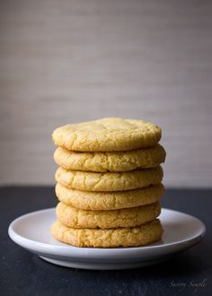 a stack of cookies sitting on top of a white plate