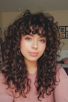 Rock a Curly Pixie Cut that’s perfect for round faces, offering a chic and playful look..... Curly Aline Haircut, Long Hair Curly Bangs, Curly Mid Length Hairstyles, Curly Hair Cuts Bangs, Curly Bang Hairstyles, Curly Hair Wispy Bangs, Curly Bangs Haircut, Medium Curly Haircuts With Bangs, Perm With Bangs