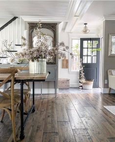 the instagram page shows an image of a dining room with wood floors and white walls