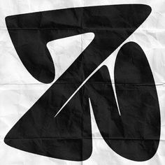 a black and white photo of a logo on a piece of paper with the letter k in it