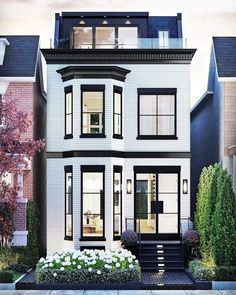 a two story white house with black trim