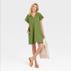 Brand New With Pockets. Relaxed Fit Green Mini Dress For Summer, Casual Green Knee-length Mini Dress, Green Relaxed Fit Mini Dress For Summer, Green Shift Mini Dress With Short Sleeves, Green Relaxed Fit Summer Dress, Green Relaxed Fit Mini Dress, Relaxed Fit Summer Dress In Green, Green Shift Mini Dress For Beach, Casual Cotton V-neck Midi Dress