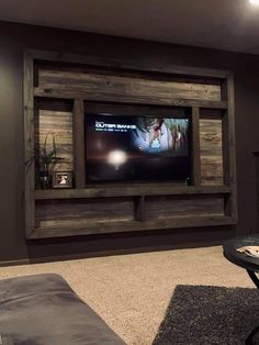 a living room with a television mounted to the wall