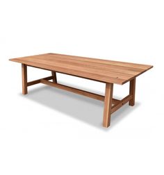 a wooden table sitting on top of a white floor