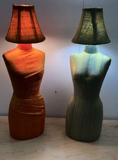 two lamps sitting next to each other on a table