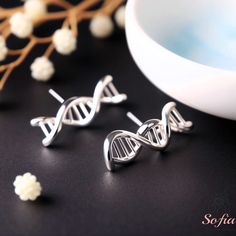 These earrings are perfect for anyone who loves science jewelry, simple jewelry, or minimalist fashion. They are a unique and meaningful gift for yourself or someone special. You can wear them for any occasion, as they have a versatile and elegant design. - Material : Stainless Steel - Size: about 15 MM - Due to different light and screen, the color may be slightly different from the picture. - Every natural stone is measured by hand, there may be a slightly error in each size. Hope you would un Double Helix, Dna Earrings, Dna Jewelry, Twist Earrings, Science Jewelry, Earrings Double, Science Gifts, Jewelry Simple, Simple Jewelry