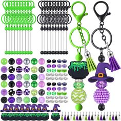 a collection of assorted key chains and accessories for halloween or mardi gras