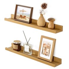 two wooden shelves with pictures and candles on them