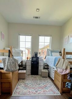 a room filled with lots of wooden furniture and windows next to a rug on top of a hard wood floor