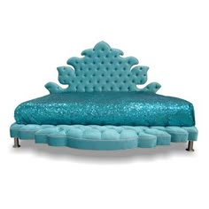 a bed with blue sequins on the headboard and foot board, sitting in front of a white background