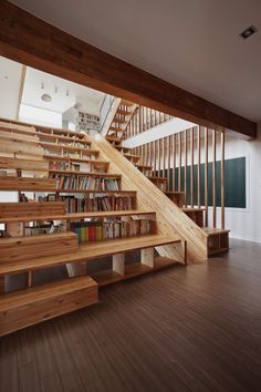 a wooden staircase with bookshelves and shelves