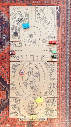 an overhead view of a rug with cars on it