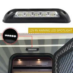 an rv with its lights on and the door open to show it's interior