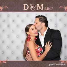 a man and woman posing for a photo booth