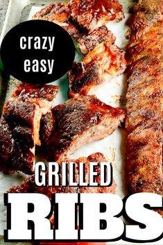 grilled ribs on a tray with text overlay that reads crazy easy grilled ribs