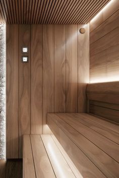 a wooden sauna with light shining on it