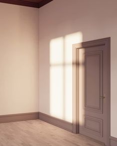 an empty room with wooden floors and white walls is shown in this image, there are two doors on either side of the door