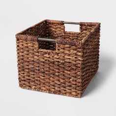 a wicker basket with an iron handle