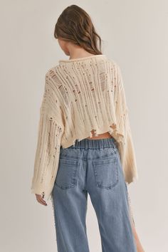 distressed sweater top, cream sweater, knit sweater, cropped sweater, fall sweater, fall fashion, fall outfit inspo, outfit inspo 2023, fall outfit, winter fashion, winter outfits, winter sweater, ootd, ootn, travel outfit, sweater, going out outfit, everyday outfit, date night outfit, online shopping, Christmas outfit, clothing brand, online clothing store, concert fashion, aesthetic fashion, holiday fashion, trendy fashion, pumpkin patch outfit, thanksgiving outfit, sweater weather #fallfashio Hole Sweater Outfit, Casual Ripped Sweater For Fall, Distressed Long Sleeve Sweater For Spring, Casual Cropped Pointelle Knit Sweater, Casual Cropped Sweater In Pointelle Knit, Casual Spring Sweater With Frayed Hem, Casual Sweater With Frayed Hem For Spring, Thanksgiving Outfit Sweater, Outfit Inspo 2023