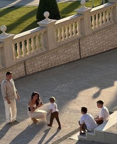 a group of people that are sitting on some steps